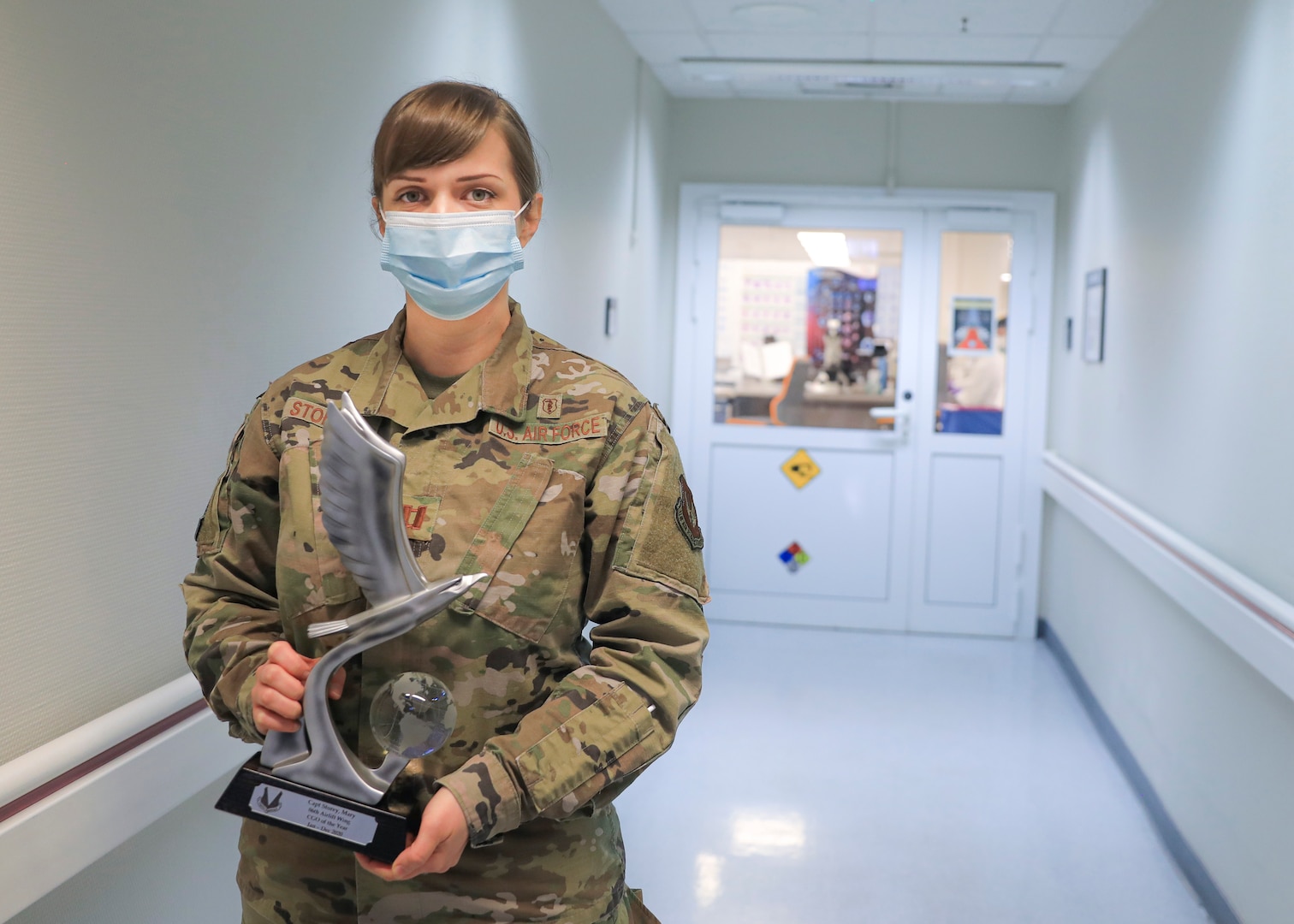 U.S. Air Force Capt. Mary Storey, chief, Core Laboratory, Landstuhl Regional Medical Center, inspects a laboratory technician's work at LRMC, March 21. Storey, a native of Indian Heights, Indiana, was recognized as the 86th Airlift Wing's Company Grade Officer of the Year, for her contributions to Joint-Service efforts to combat the spread of COVID-19 as part of LRMC. Assigned to U.S. Air Forces in Europe and Air Forces Africa, the 86th AW is the parent organization of seven groups and 30 squadrons across four military installations in Germany, Spain, Belgium and Portugal.