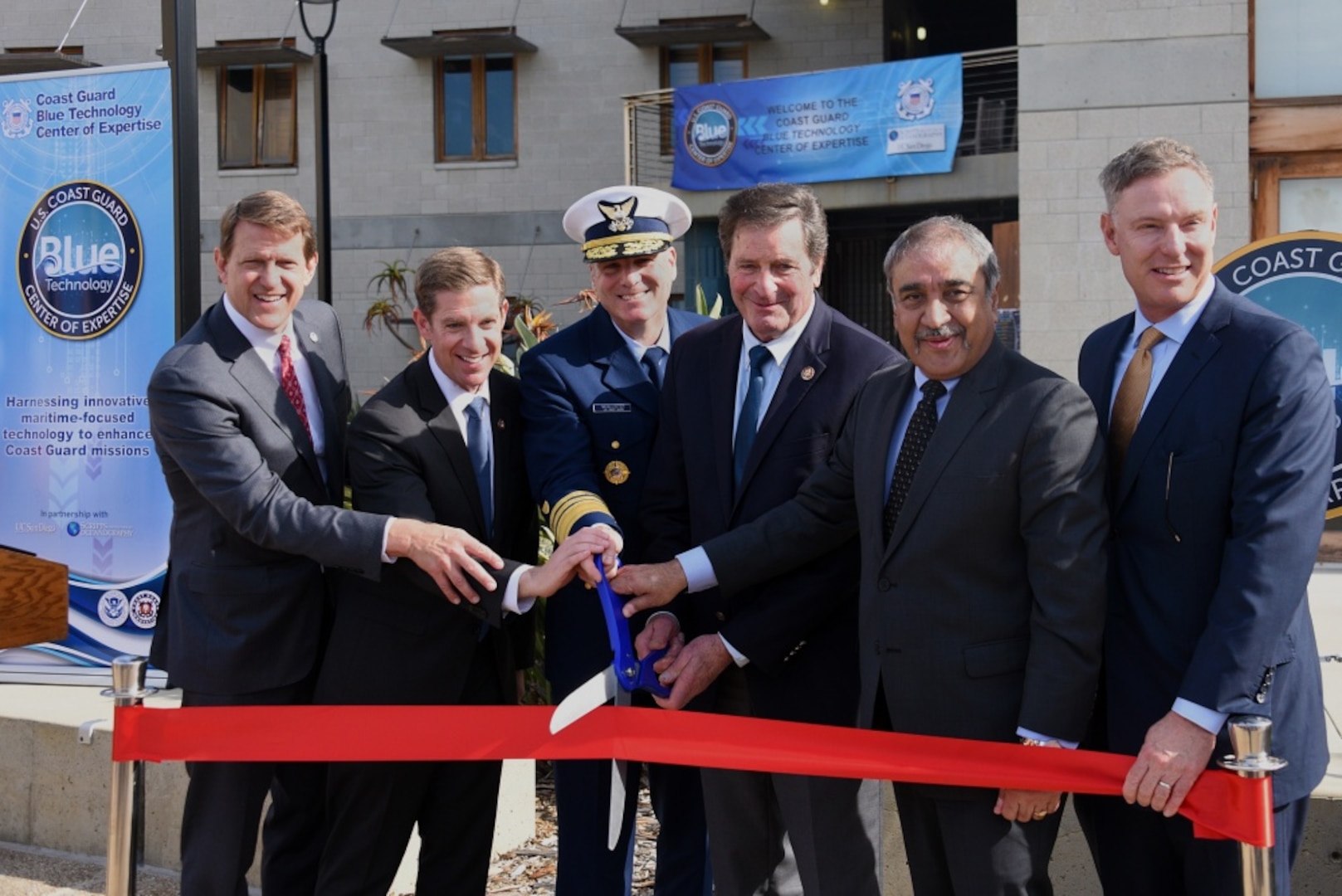 Port of San Diego Commissioner Marshall Merrifield, Rep. Mike Levin, Coast Guard Deputy Commandant for Mission Support Vice Adm. Michael F. McAllister, Rep. John Garamendi, Chancellor of the University of California San Diego Pradeep Khosla, and Rep. Scott Peters take part in a ribbon-cutting ceremony at Scripps Institution of Oceanography at the University of California San Diego Jan. 24, 2020. The Coast Guard entered into an agreement with Scripps Institution of Oceanography to establish the Blue Technology Center of Expertise, which will provide opportunities for rapid identification and integration of new blue technologies into current Coast Guard capabilities. (Coast Guard photo by Petty Officer 1st Class Patrick Kelley.)