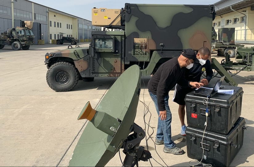 Hector Cerrato shows Staff Sgt. Sidney Johnson, a military intelligence Soldier assigned to 2nd Cavalry Regiment, how to set up at Global Broadcast Service system in a Tactical Intelligence Ground Station. The GBS is a one-way broadcast capability supporting timely delivery of unclassified and classified video, large quantities of unclassified or classified digital data and other theater information transfer needs for the Army, The GBS is deployed and used worldwide. 

Cerrato, who served 20 years as an active duty Soldier and 18 years as an Army civilian and Logistics Assistance Representative, is an Intercept Electronic Warfare Senior Technical Representative from Communications-Electronics Command attached to the 405th Army Field Support Brigade. 

Cerrato provided technical assistance and instruction to Johnson on the GBS at the regimental motor pool in Grafenwoehr April 1 in preparation for exercise Dragoon Ready 2021. Previously, he has provided this highly technical training to Soldiers from the 66th Military Intelligence Brigade, the 173rd Airborne Brigade and the 2nd Cav. Regt. 

Logistics Assistance Representatives are Army civilians serving in motor pools, hangars, maintenance shops, and offices around the world. Highly trained, they bring more than two dozen specialty skills to Army equipment readiness requirements. They are all part of the U.S. Army Sustainment Command’s global network of Army Field Support Brigades and are linked to every echelon of the Army in the field. The 405th AFSB has several LARs with multiple specialties assigned across Europe.
