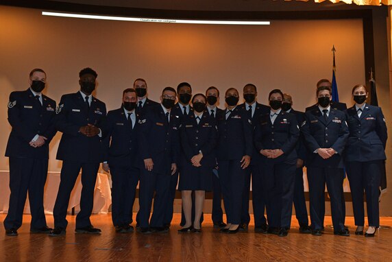 Graduates of Airman Leadership School Class 21-C pose for a class photo in the Base Theater on Goodfellow Air Force Base, Texas, April 1, 2021. ALS is a four-week course designed to give senior airmen an understanding of their role as military supervisors and how they contribute to the overall goals and missions of the Air Force. (U.S. Air Force photo by Senior Airman Ashley Thrash)