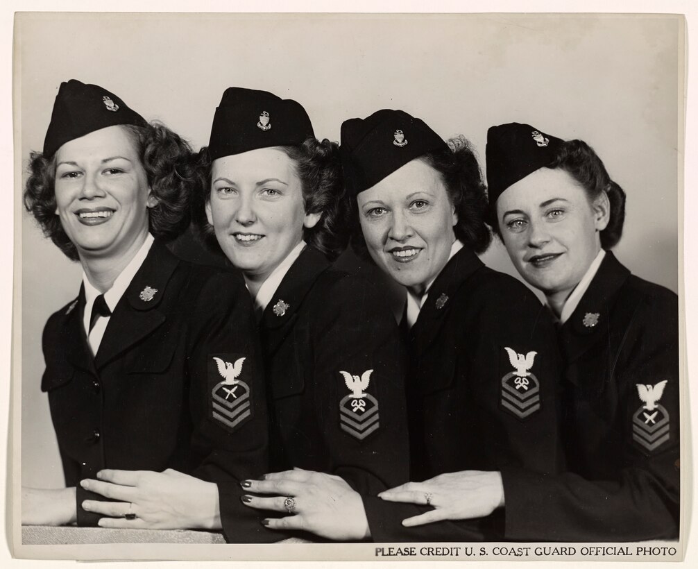 A 1944 photo of four SPAR CPOs:  Left to right: Judith Balinsky, Chief Yeoman, of Akron; Leone Peppard, Chief Storekeeper, of Grand Forks, North Dakota; Leta Belgard, Chief Storekeeper, of Fairport, New York, and Frances Brown, Chief Yeoman, of San Francisco."