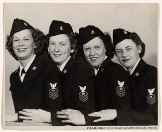 A 1944 photo of four SPAR CPOs:  Left to right: Judith Balinsky, Chief Yeoman, of Akron; Leone Peppard, Chief Storekeeper, of Grand Forks, North Dakota; Leta Belgard, Chief Storekeeper, of Fairport, New York, and Frances Brown, Chief Yeoman, of San Francisco."