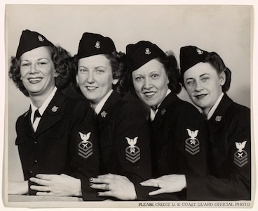 A 1944 photo of four SPAR CPOs:  Left to right: Judith Balinsky, Chief Yeoman, of Akron; Leone Peppard, Chief Storekeeper, of Grand Forks, North Dakota; Leta Belgard, Chief Storekeeper, of Fairport, New York, and Frances Brown, Chief Yeoman, of San Francisco."