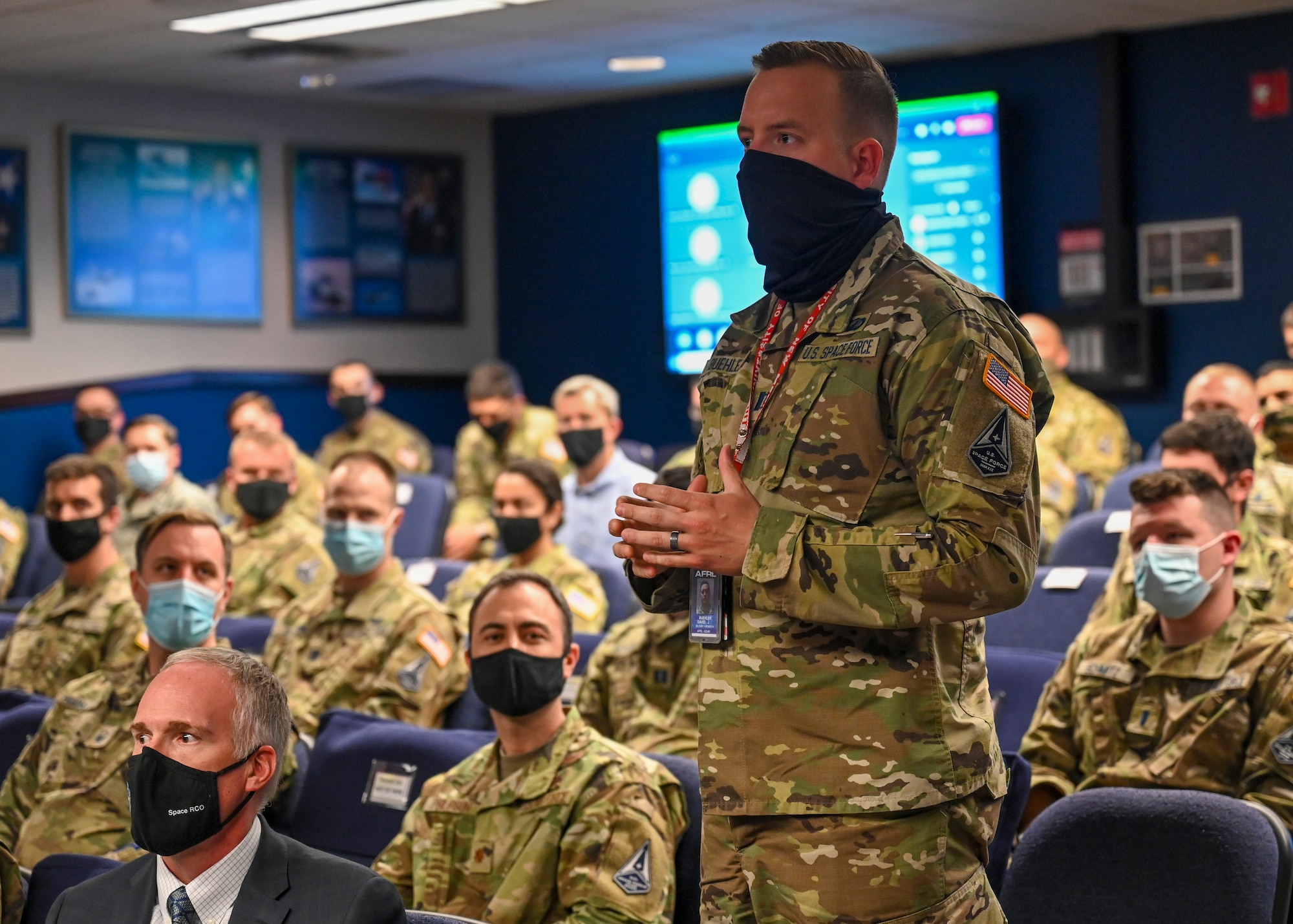 Capt. David Buehler asks a question during All Call