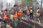 Nathan Kirby, London-Laurel Rescue Squad leader and public information officer, shares tips on looking for people with members of the Kentucky National Guard during search and rescue training in the hills of Daniel Boone National Forest. The training was held March 27-30, 2021.