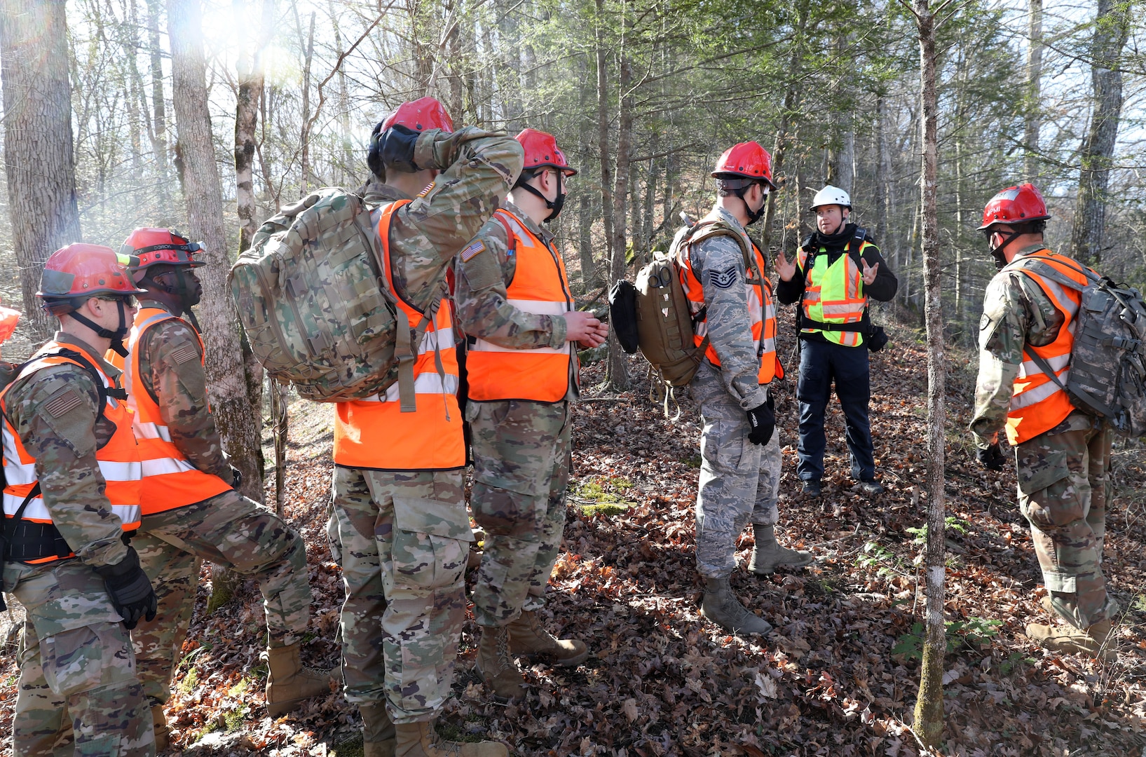 Nathan Kirby, London-Laurel Rescue Squad leader and public information officer, shares tips on looking for people with members of the Kentucky National Guard during search and rescue training in the hills of Daniel Boone National Forest. The training was held March 27-30, 2021.