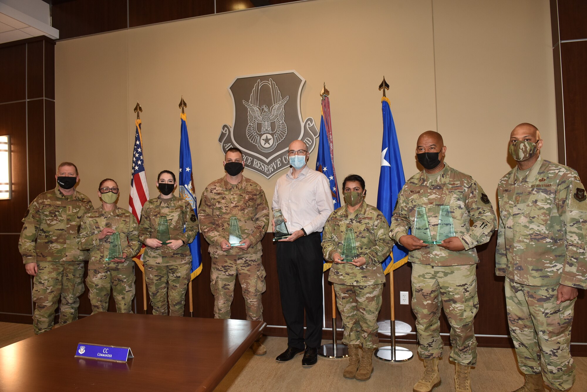 Lt. Gen. Richard Scobee, commander Air Force Reserve Command, award winners or their representatives, and Chief Master Sgt. Travon Dennis, AFRC command first sergeant, pose for a picture at the end of the AFRC Annual Award Presentation held in the main conference room of AFRC Headquarters, April 2, 2021, Robins Air Force Base, Georgia.