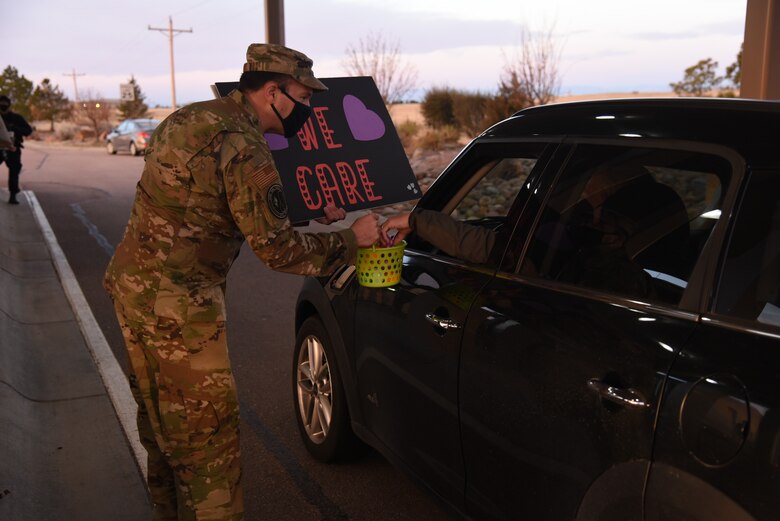 Leadership from across Schriever Air Force Base, Colorado, hand out Easter eggs to Airmen and Guardians as part of the installation’s participation in the “Don’t Give up Movement” at Enoch Gate, April 2, 2021. The movement was founded by Amy Wolff in response to learning about the suicide rates in her Oregon community. (U.S. Space Force photo by Airman 1st Class Brooke Wise)
