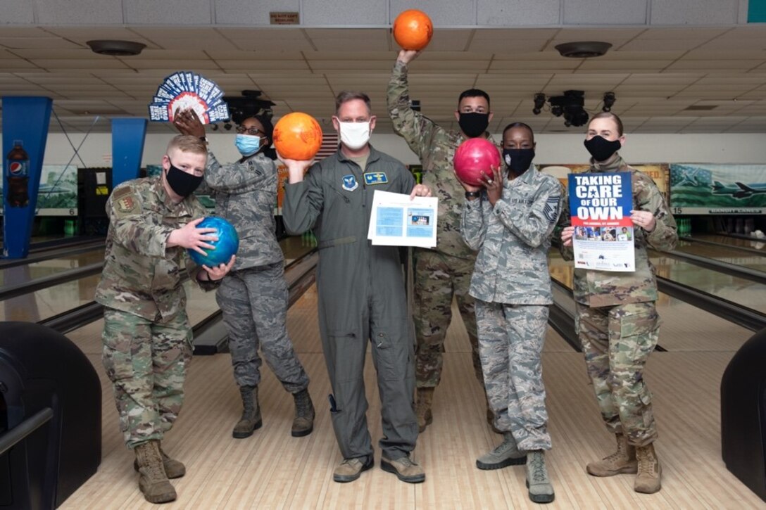 Col. David Doss, the 28th Bomb Wing commander (center), and Chief Master Sgt. Rochelle Hemingway, the 28th BW command chief (second from right), join their fellow Raiders in support for the Air Force Assistance Fund during a special event at Ellsworth Air Force Base, S.D., March 31, 2021. The base’s goal is to raise $36,733 for AFAF before April 23. (U.S. Air Force photo by Airman 1st Class Quentin K. Marx)