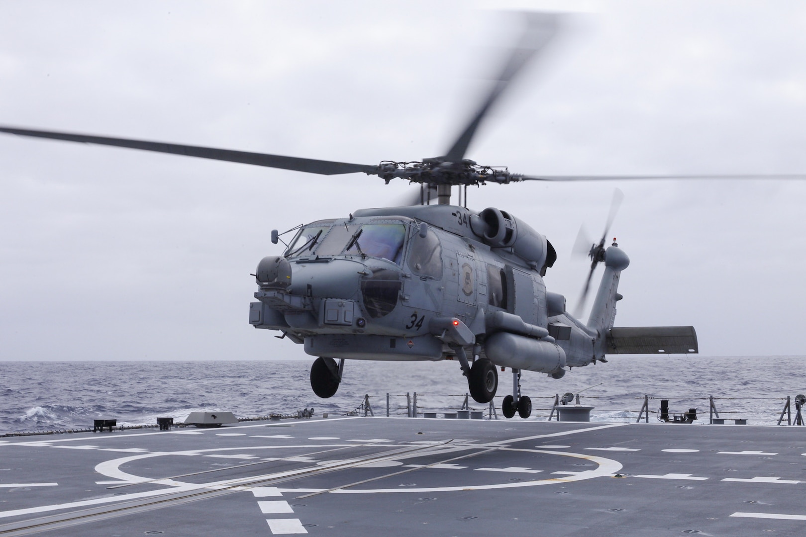 Australian sailors launch Sea Hawk helicopters aboard USS John Finn