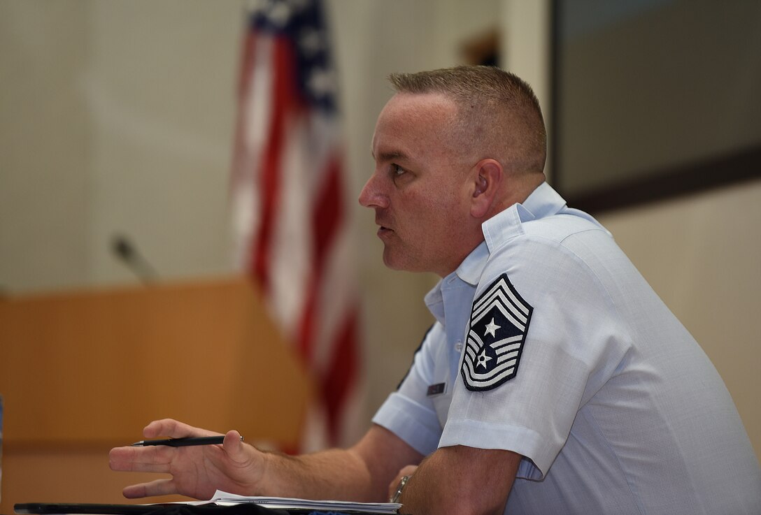 U.S. Air Force Chief Master Sgt. David Wolfe, Pacific Air Forces (PACAF) Command Chief, speaks before a crowd about leadership philosophy during Pacific Paladin at the Aloha Conference Center, Joint Base Pearl Harbor-Hickam, Hawaii, March 31, 2021. Pacific Paladin is a new PACAF professional development platform focused on providing strategic mentorship to non-commissioned officers and senior non-commissioned officers. (U.S. Air Force photo by Master Sgt. Miguel Lara)