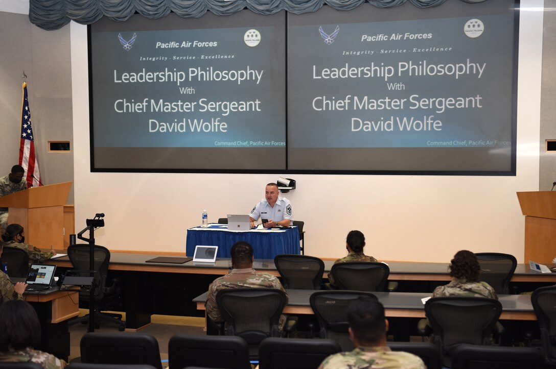 U.S. Air Force Chief Master Sgt. David Wolfe, Pacific Air Forces (PACAF) Command Chief, speaks before a crowd about leadership philosophy during Pacific Paladin at the Aloha Conference Center, Joint Base Pearl Harbor-Hickam, Hawaii, March 31, 2021. Pacific Paladin is a new PACAF professional development platform focused on providing strategic mentorship to non-commissioned officers and senior non-commissioned officers. (U.S. Air Force photo by Master Sgt. Miguel Lara)