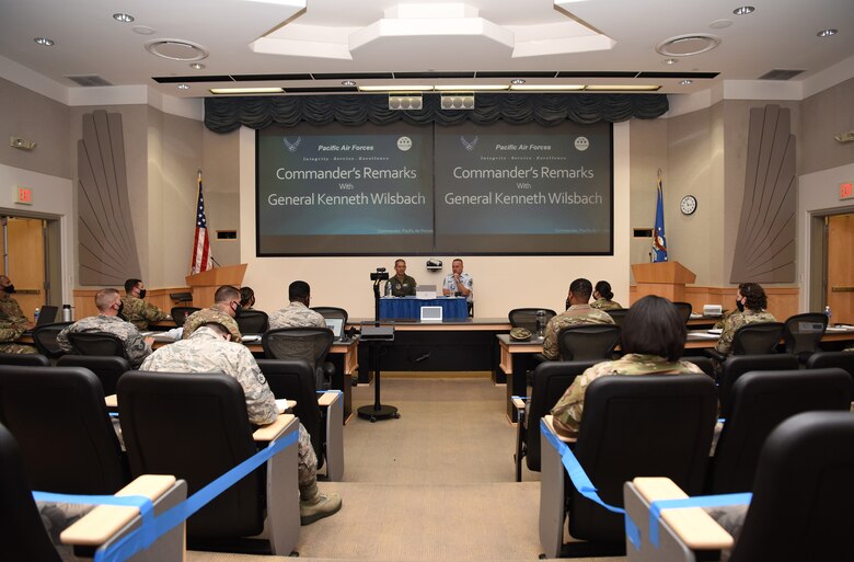 U.S. Air Force Gen. Ken Wilsbach, Pacific Air Forces (PACAF) commander, left-center, and Chief Master Sgt. David Wolfe, PACAF Command Chief discuss command priorities with Airmen from around the Pacific during Pacific Paladin at the Aloha Conference Center, Joint Base Pearl Harbor-Hickam, Hawaii, March 31, 2021. Pacific Paladin, a new PACAF professional development platform focused on mentoring staff sergeants through senior master sergeants, bridging the gap between the tactical, operational and strategic level of performance. More than 200 Airmen from nine PACAF installations attended the seminar in-person and virtually. (U.S. Air Force photo by Tech. Sgt. Zachary Vaughn)