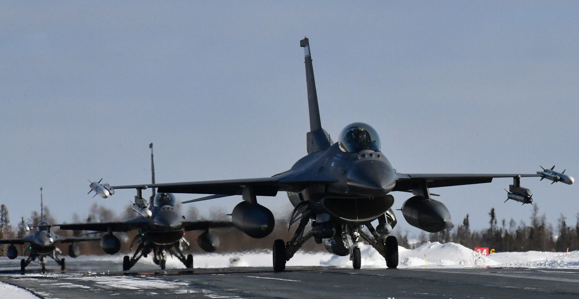 U.S. Air Force F-16’s from the Minnesota Air National Guard’s 148th Fighter Wing arrive at Yellowknife, Canada during North American Aerospace Defense Command’s Arctic air defense exercise, Amalgam Dart 21-02, March 20, 2021.