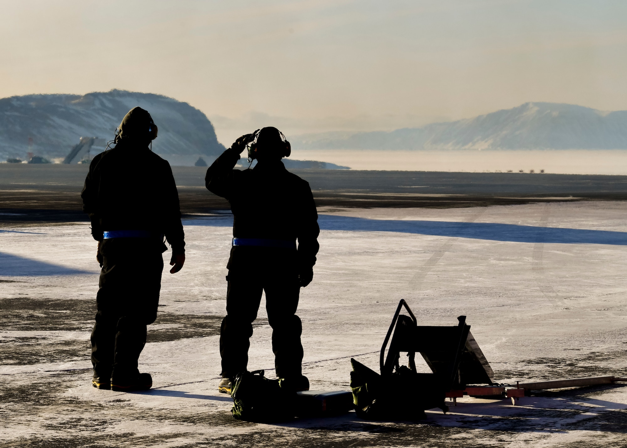 U.S. Air Force Airmen from the 148th Maintenance Squadron await the arrival of F-16s at Thule Air Base, Greenland during North American Aerospace Defense Command’s Arctic air defense exercise, Amalgam Dart 21-2, March 22, 2021.