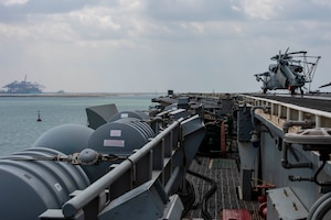 210402-N-VG565-1061 SUEZ CANAL (April 2, 2021) The aircraft carrier USS Dwight D. Eisenhower (CVN 69) transits the Suez Canal, April 2. The Eisenhower Carrier Strike Group is deployed to the U.S. 5th Fleet area of operations in support of naval operations to ensure maritime stability and security in the Central Region, connecting the Mediterranean and Pacific through the Western Indian Ocean and three strategic choke points. (U.S. Navy photo by Mass Communication Specialist Seaman Aimee Ford)