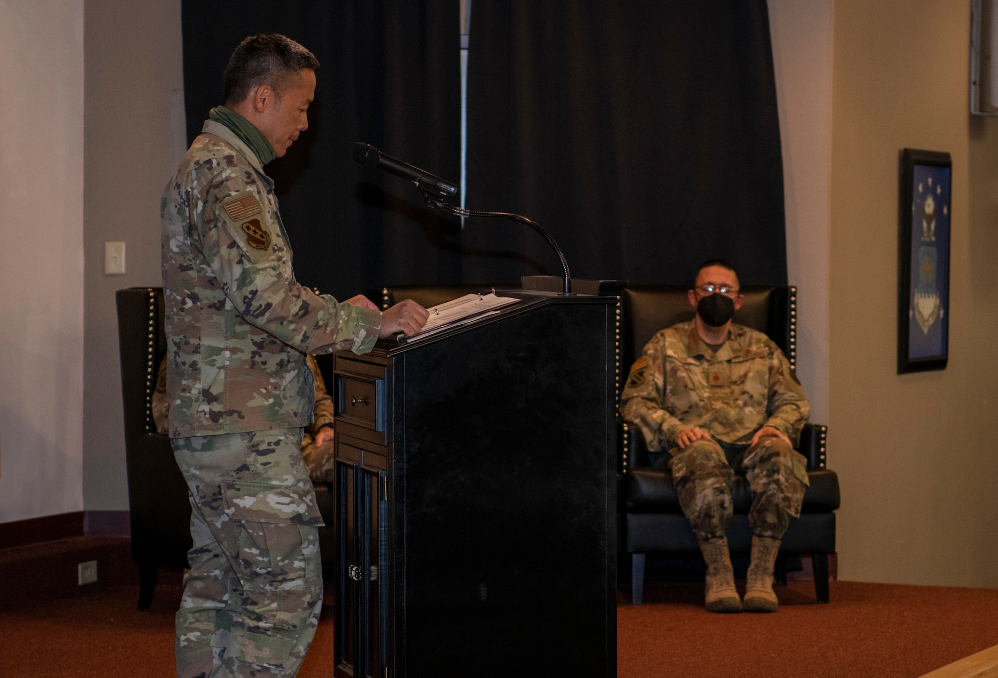 Col. Ed Sumangil, 7th Bomb Wing commander, left, speaks during the assumption of the stole ceremony for Chaplain (Maj.) Gabriel Rios, 7th Bomb Wing wing chaplain, right, at Dyess Air Force Base, Texas, Mar. 24, 2021.