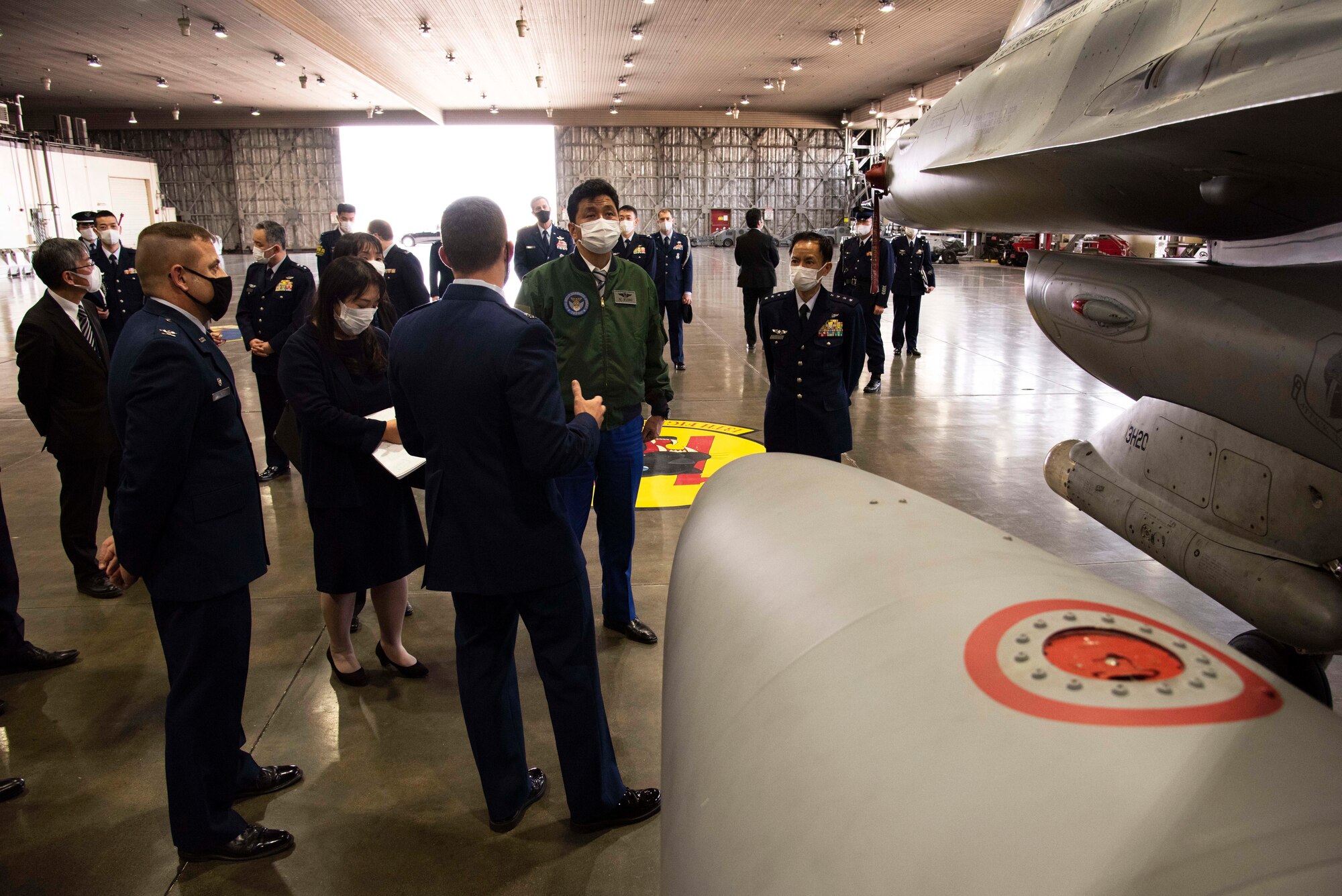 Capt. Austin Bangerter, 13th Fighter Squadron pilot, briefs Japan Minister of Defense, Nobuo Kishi, about the F-16 Fighting Falcon, and the 35th FW’s mission to defend Japan, during a visit at Misawa Air Base on April 3, 2021. During the visit senior leaders emphasized the importance of U.S. and Japanese bilateral interoperability through realistic, high quality training and operations. They also discussed the strategic importance of Misawa Air Base as the premier location for aircraft to conduct training in the Indo-Pacific region. (U.S. Air force photo by Maj. Cody Chiles)