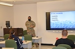 Staff Sgt. William Cox, an Army instructor in the METC Occupational Therapy Assistant program, teaches Army and Navy students about heat modalities used in occupational therapy treatments.