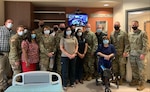 CRDAMC team stands with TCC installation team at the tele-critical care services "go-live" event April 1.