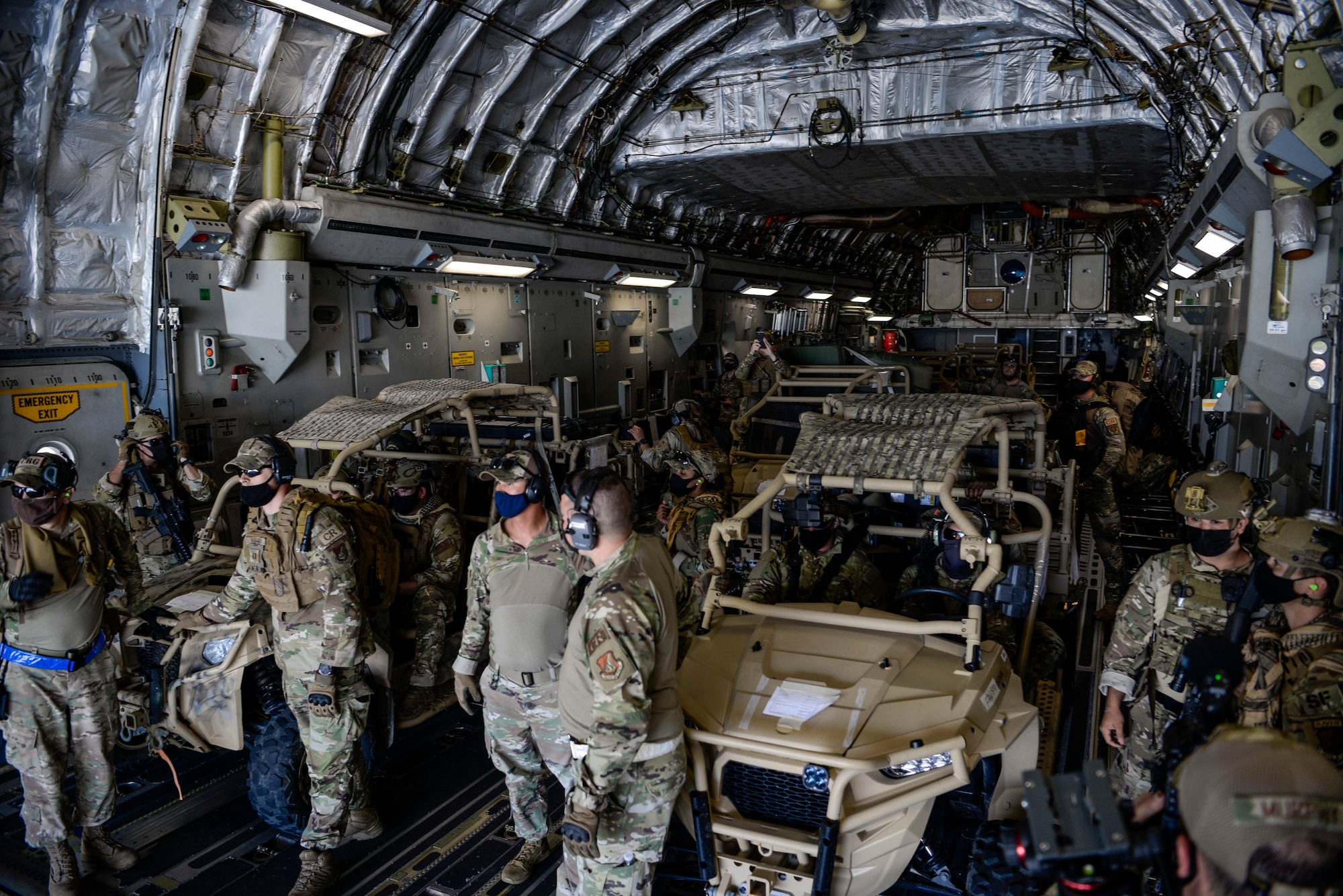 U.S. Air Force Airmen assigned to the 36th Contingency Response Group, prepare to off load a C-17 Globemaster III assigned to the 8th Airlift Squadron, McChord Air Force Base, Wash. during a field training exercise on Wake Island, Western Pacific, April 2, 2021.