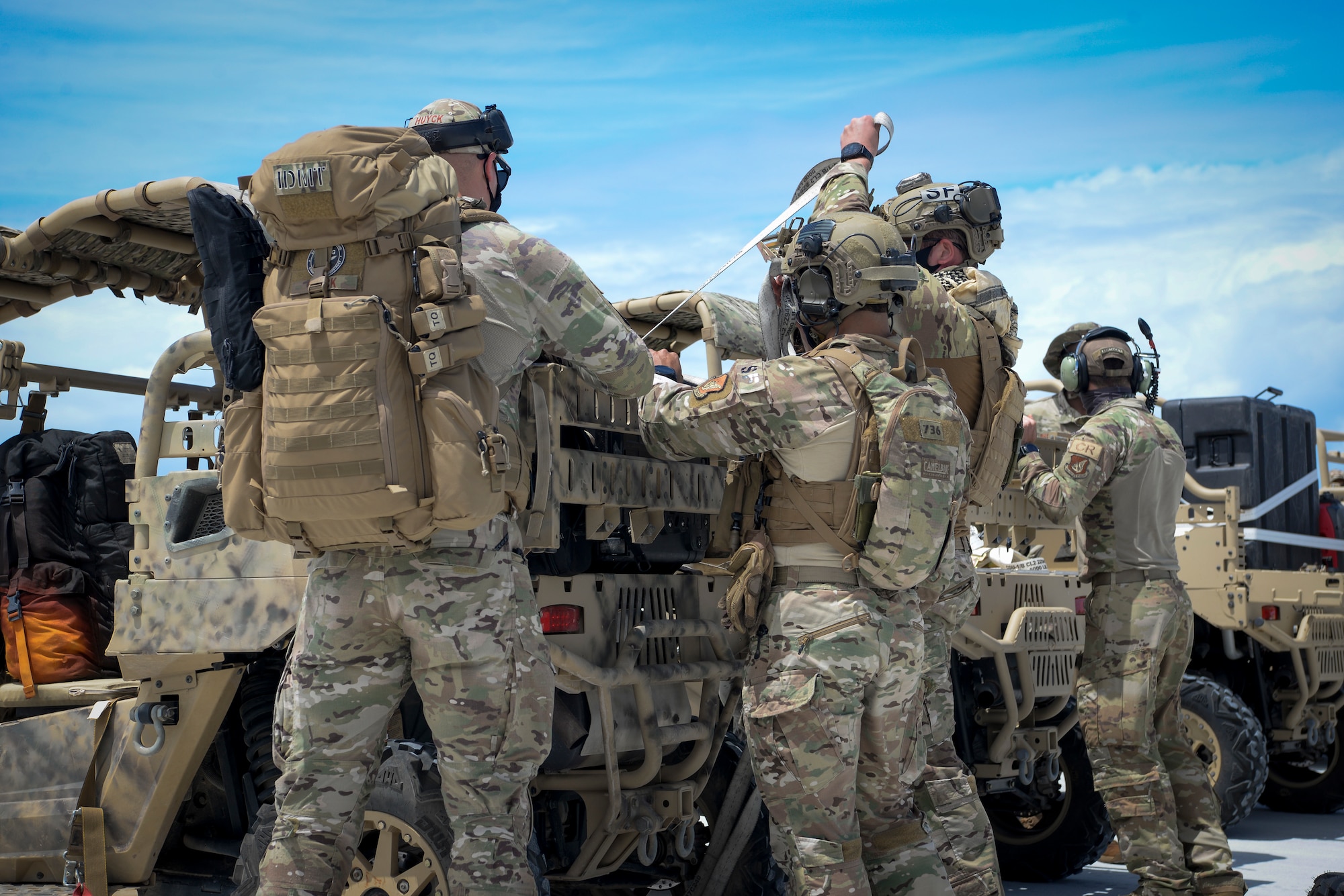 U.S. Air Force Airmen assigned to the 36th Contingency Response Group, unload training gear during a field training exercise on Wake Island, Western Pacific, April 2, 2021.