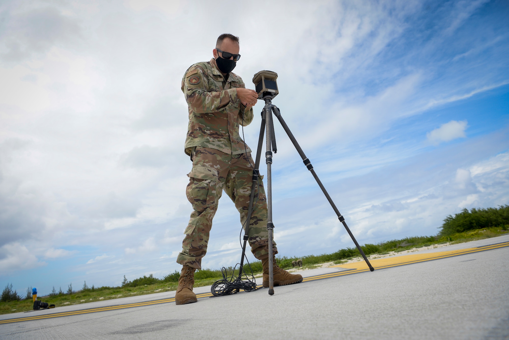 U.S. Air Force Master Sgt. Jordan Smith, weather flight chief assigned to the 36th Operation Support Squadron, sets up weather systems equipment gear during a field training exercise on Wake Island, Western Pacific, April 2, 2021.