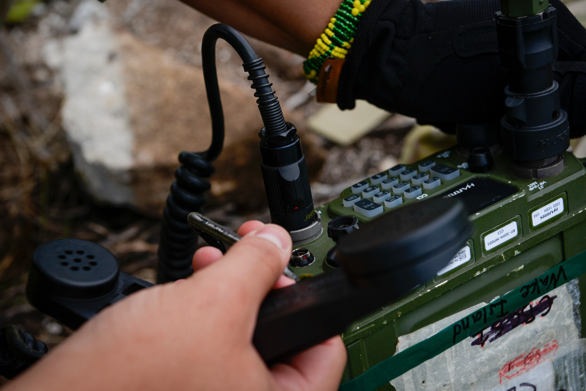 U.S. Air Force Airman 1st Class Brayan Rivera-Donalds; radio frequency transmission systems technician assigned to the 644th Combat Communications Squadron; checks the communication signal to the aircrew during a field training exercise on Wake Island; Western Pacific; April 2; 2021.