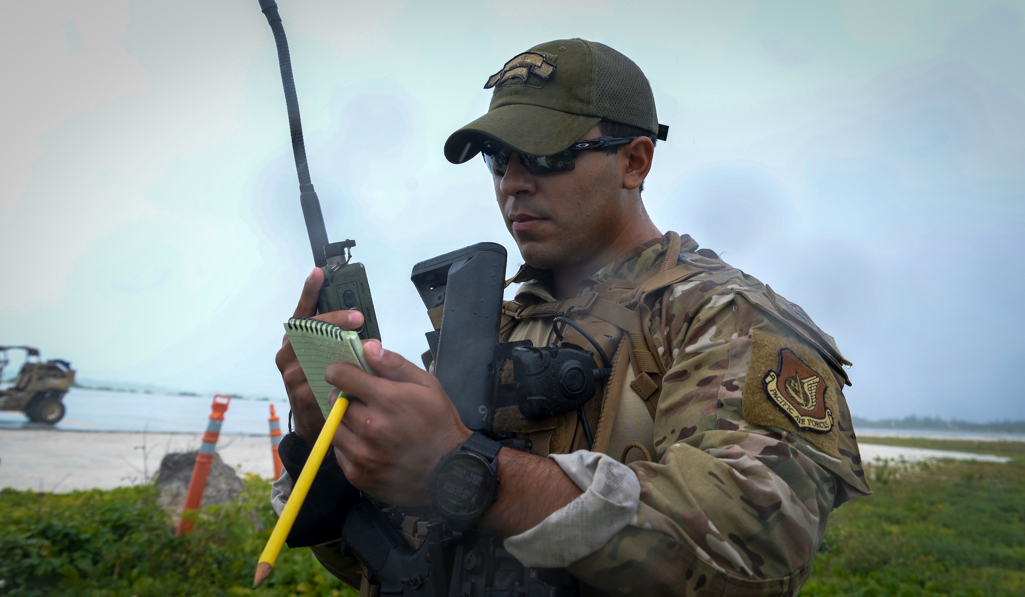 U.S. Air Force Senior Airman Juan Ordonez, fly away security team member assigned to the 736th Security Forces Squadron, calls in a nine line report during a field training exercise on Wake Island, Western Pacific, April 2, 2021.