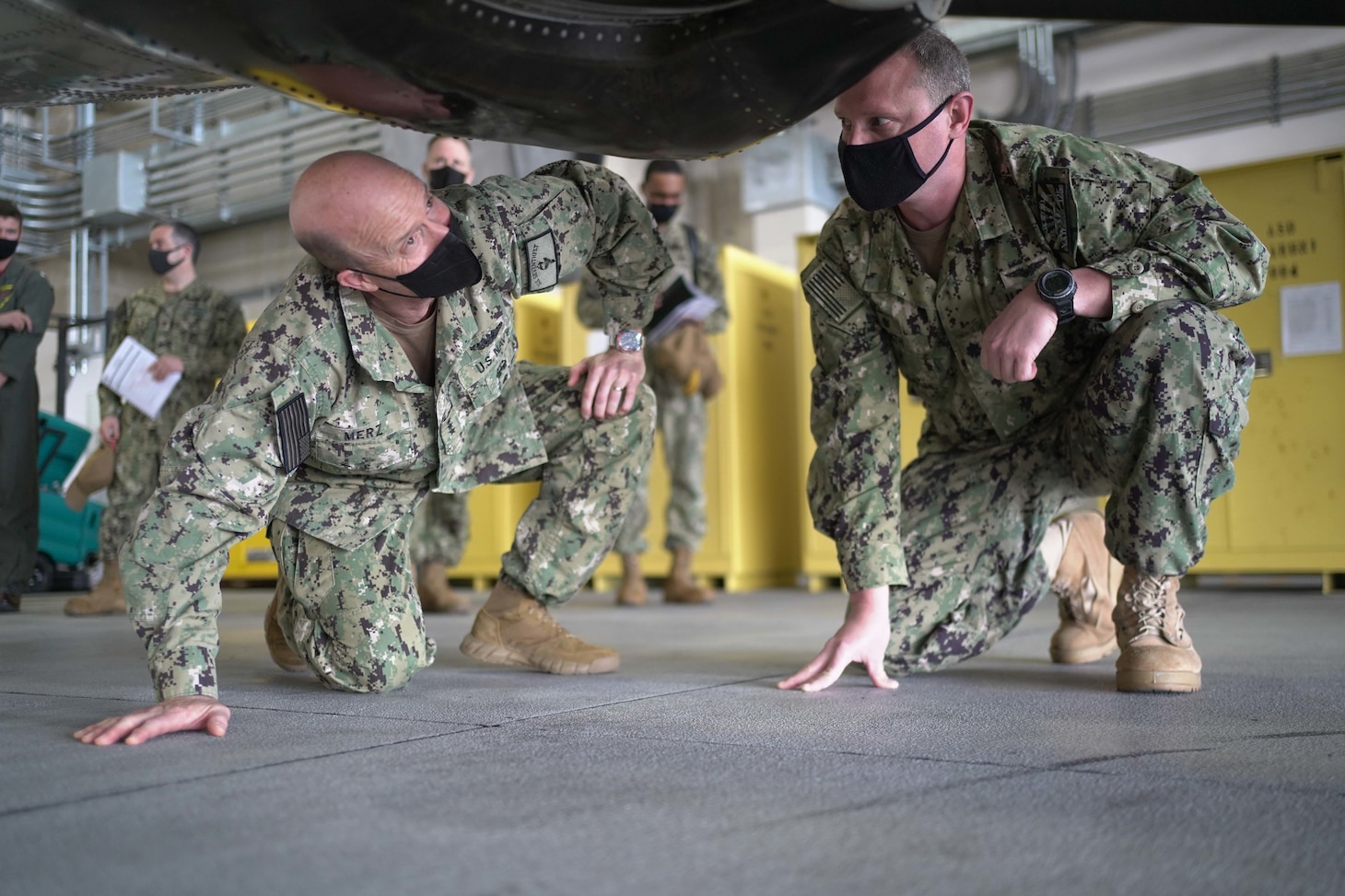 U.S. Navy Vice Admiral Bill Merz, left, commander of 7th Fleet, participates in a tour of MCAS Iwakuni, Japan, Apr. 1, 2021. Leadership made visits with squadrons that make up Carrier Air Wing (CVW) 5, including the "Tigertails" of Carrier Airborne Early Warning Squadron (VAW) 125 and the "Shadowhawks" of Electronic Attack Squadron (VAQ) 141, as well as other tenant commands. The purpose of the visit was to focus on engaging with the forward deployed naval forces that support the fleet.