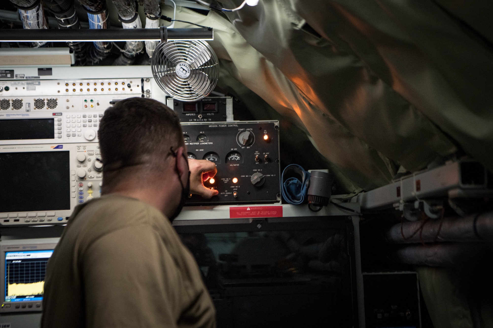 a man fixes a radio