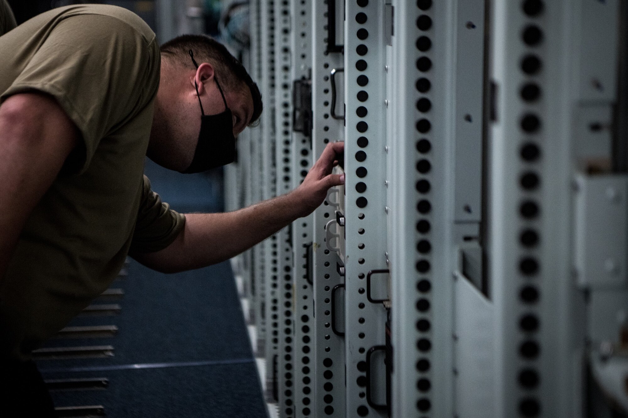 a man works on a computer router