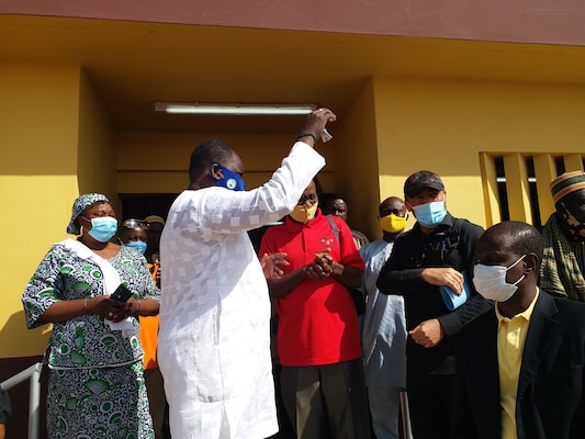 The Mayor of Malanville, accepts keys to a newly constructed health clinic from Humanitarian Assistance Program Coordinator Cosme Quenum, a local national with the U.S. Embassy in Cotonou, Benin in the village of Money, Benin in Africa at the end of January 2021. The clinic and various associated facilities also built with it comprise one of two similar clinic projects recently completed by the U.S. Army Corps of Engineers in that region of Benin through funding from AFRICOM and coordinated closely with the U.S. State Department.