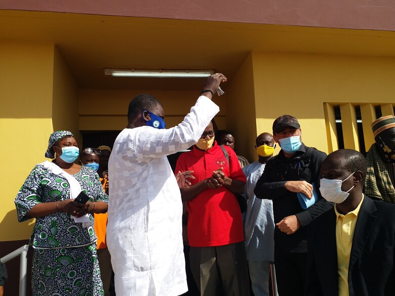 The Mayor of Malanville, accepts keys to a newly constructed health clinic from Humanitarian Assistance Program Coordinator Cosme Quenum, a local national with the U.S. Embassy in Cotonou, Benin in the village of Money, Benin in Africa at the end of January 2021. The clinic and various associated facilities also built with it comprise one of two similar clinic projects recently completed by the U.S. Army Corps of Engineers in that region of Benin through funding from AFRICOM and coordinated closely with the U.S. State Department.