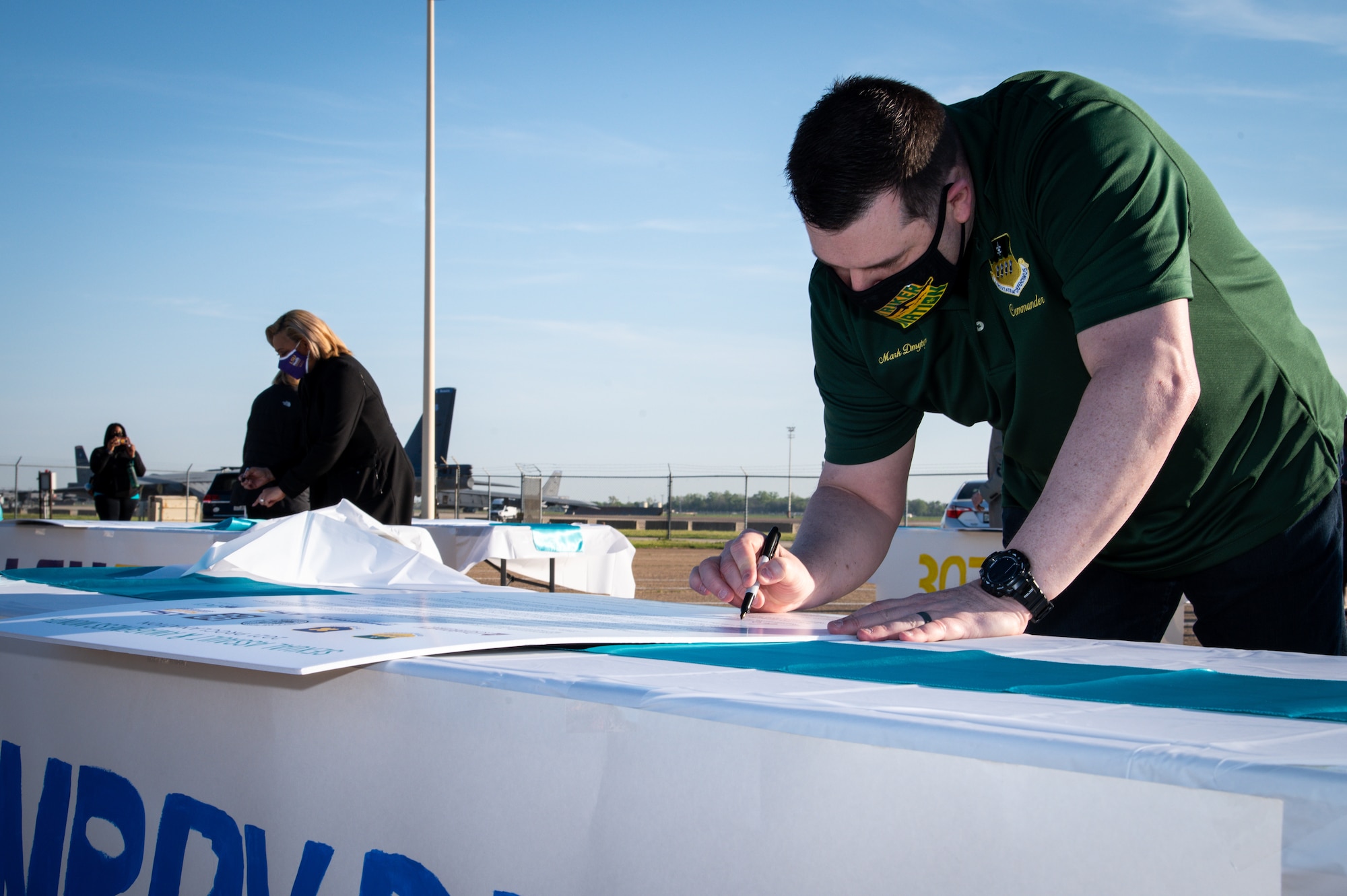 Col. Mark Dmytryszyn, 2nd Bomb Wing commander, signs a Sexual Assault Awareness Month proclamation at Barksdale Air Force Base, Louisiana, April 2, 2021.