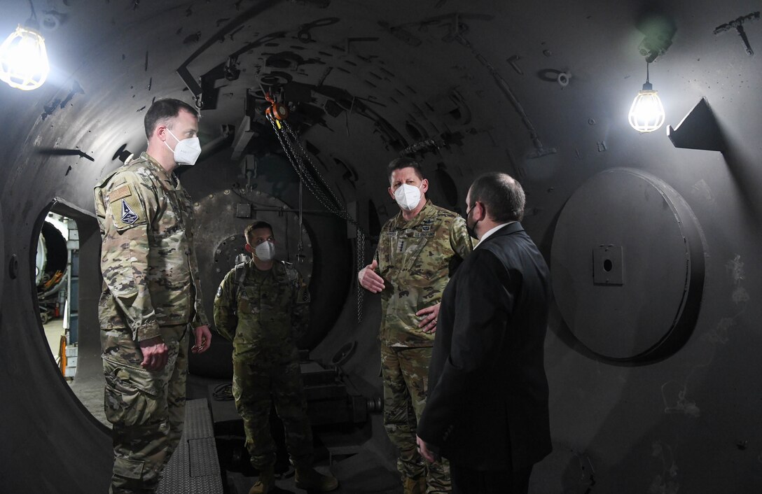 Gen. David Thompson, second from right, vice chief of space operations, U.S. Space Force, poses a question to Jonathan Carroll, right, capability manager for the Arnold Engineering Development Complex Hypervelocity Flyout, Impact and Lethality Ground Test and Evaluation, about the capability as they tour Range G at Arnold Air Force Base, Tenn., headquarters of AEDC, Feb. 5, 2021. Also pictured are, from left, Col. Nick Hague, Space Force director of Test and Evaluation; and Lt. Col. David Zesinger, executive officer to the vice commander of the Space Force. (U.S. Air Force photo by Jill Pickett)