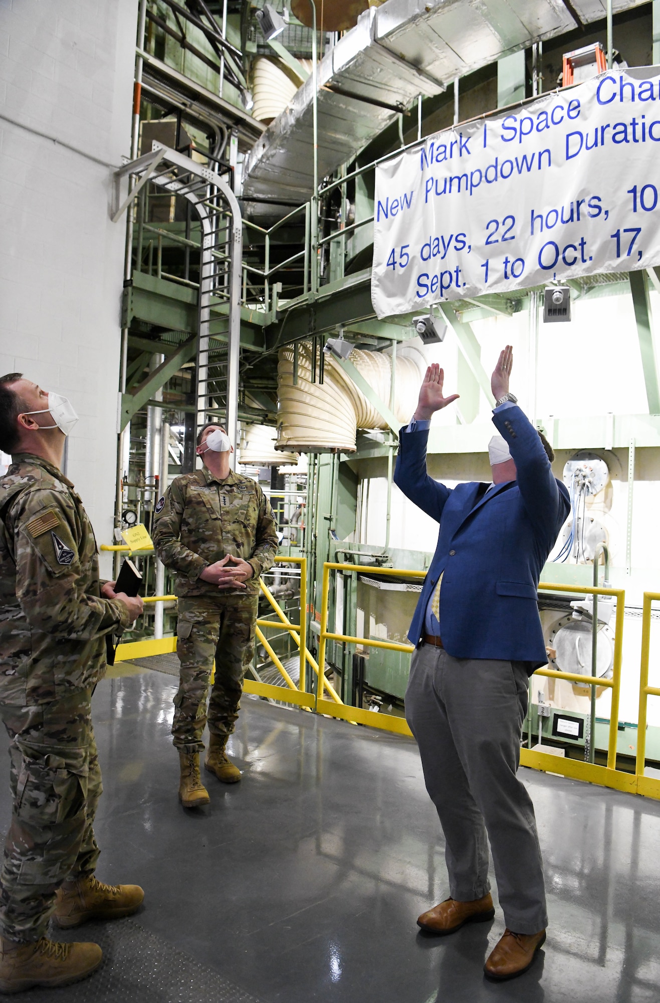 John Claybrook, right, capability manager for the Arnold Engineering Development Complex Space Asset Resilience Ground Test and Evaluation, explains how operations are conducted at the Mark 1 Aerospace Chamber to Gen. David Thompson, center, vice chief of space operations, U.S. Space Force, during a tour of a capabilities pertinent to the Space Force available at Arnold Air Force Base, Tenn., headquarters of AEDC, Feb. 5, 2021. Also pictured is Col. Nick Hague, Space Force director of Test and Evaluation. (U.S. Air Force photo by Jill Pickett)