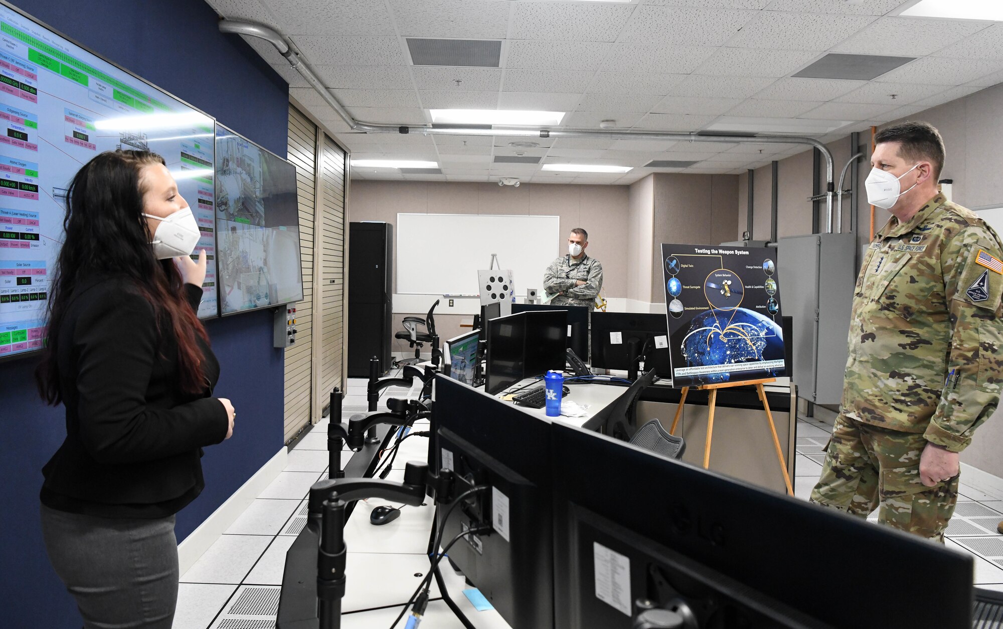 Kellye Burns, space test engineer, left, speaks about the Arnold Engineering Development Complex Space Asset Resilience capability to Gen. David Thompson, vice chief of space operations, U.S. Space Force, during a tour of the Space Threat Assessment Testbed control room at Arnold Air Force Base, Tenn., headquarters of AEDC, Feb. 5, 2021. (U.S. Air Force photo by Jill Pickett)