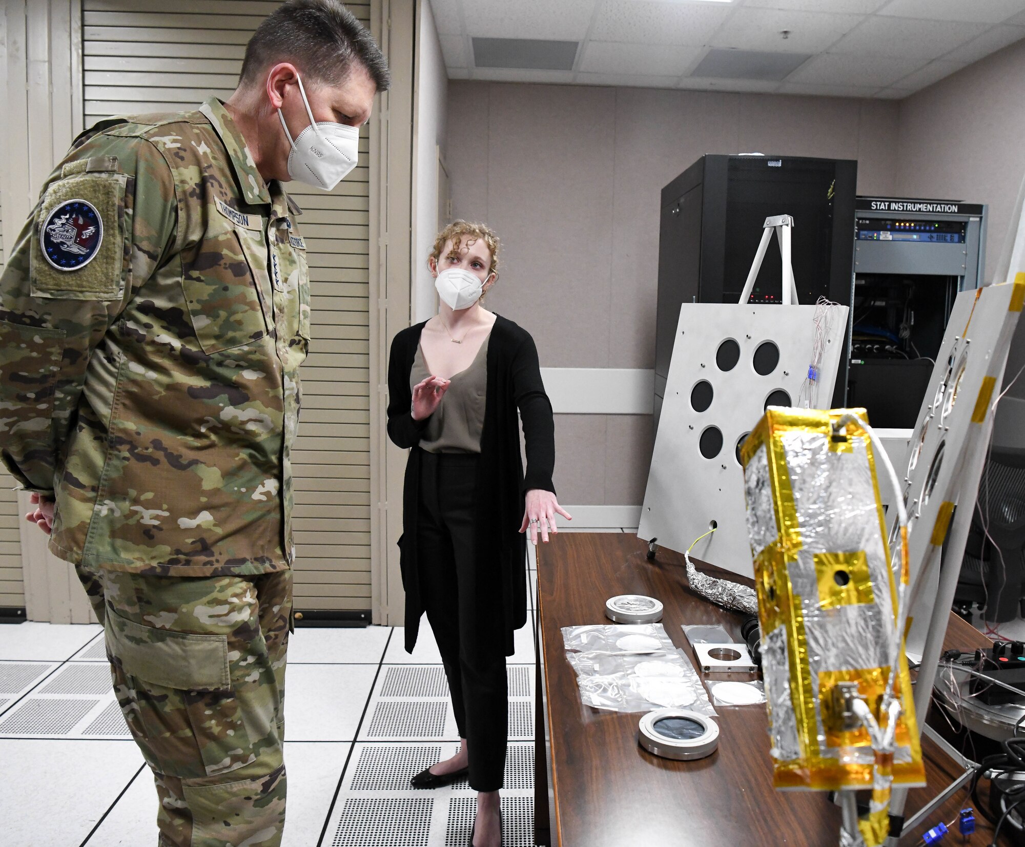 Gen. David Thompson, vice chief of space operations, U.S. Space Force, looks at samples tested in the Arnold Engineering Development Complex Space Threat Assessment Testbed as Savannah Langer, a space test engineer, briefs him on the Space Asset Resilience capability at Arnold Air Force Base, Tenn., headquarters of AEDC, Feb. 5, 2021. (U.S. Air Force photo by Jill Pickett)