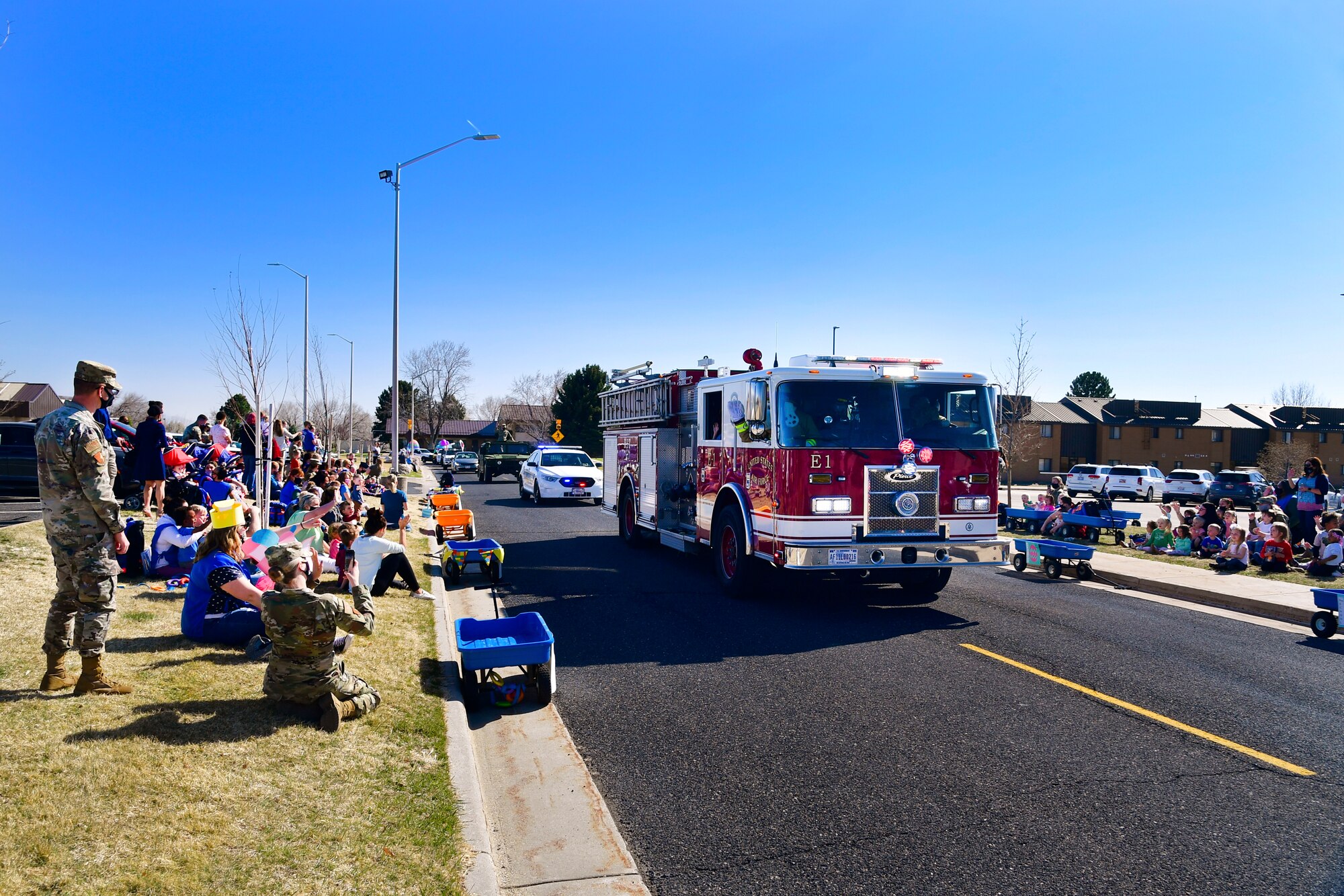 Emergency vehicles sounding sirens and flashing lights during the “Operation Bunny Trail” Easter parade.