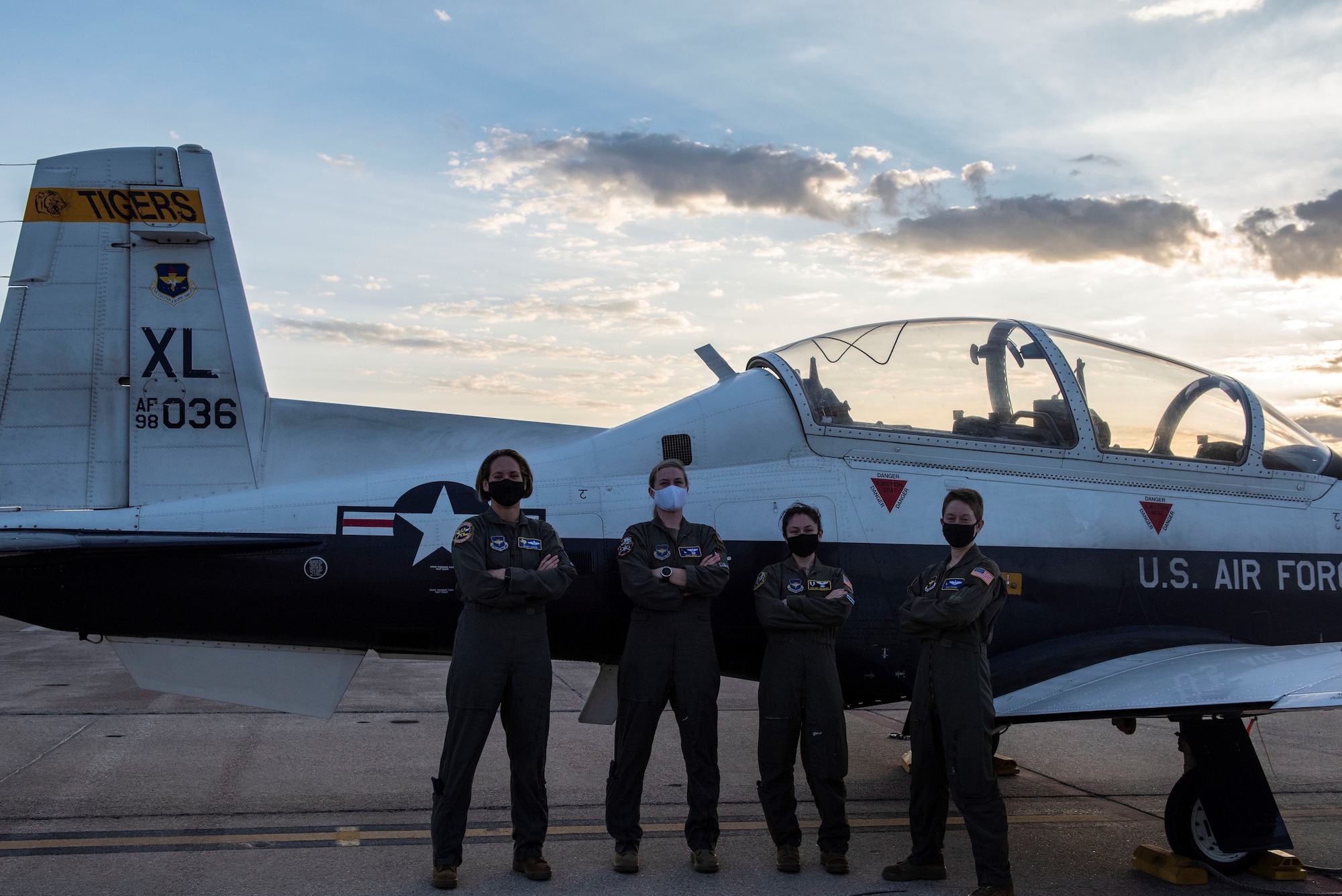 Pictured (Left to Right): Col. Cary Jones, Capt. Susan Jennie, Capt. Melany Delgado, and Maj. Emily Brown stands in front of a T-6 Texan II. The T-6 is the first aircraft all pilots must fly during there training during their time at Laughlin.(Courtesy photo taken by 2nd Lt. Esther Min)