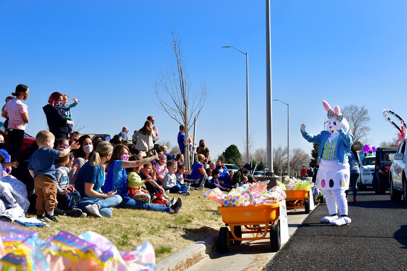 The Easter Bunny waves to families during the “Operation Bunny Trail” Easter parade in military family housing.