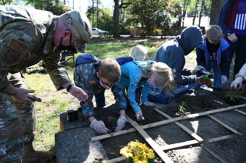 Girl planting flower