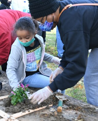 Girl planting flower