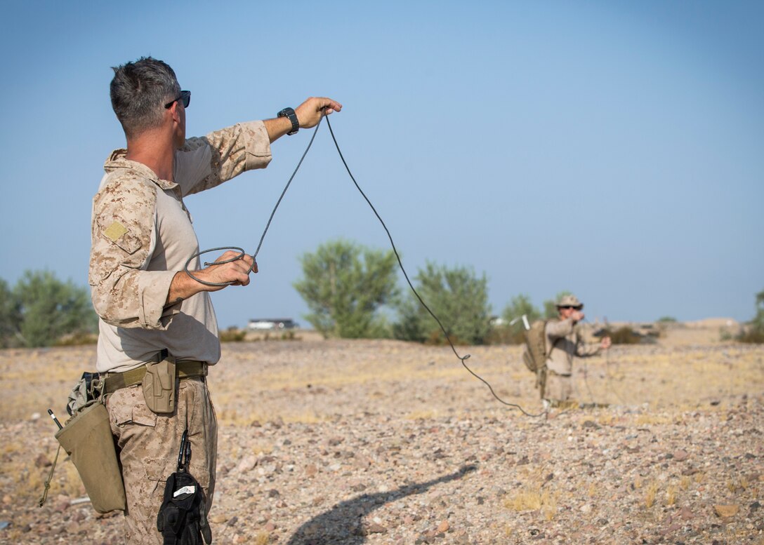 U.S. Marines stationed aboard Marine Corps Air Station (MCAS) Yuma, with Explosive Ordnance Disposal (EOD), conduct area operational clearance in support of Weapons and Tactics Instructors (WTI) course 2-20 near Camp Billy Machen, Calif., Sep. 21, 2020.