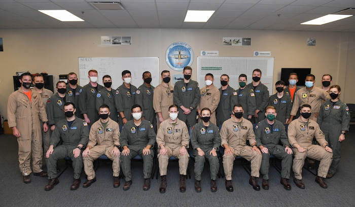 CORPUS CHRISTI, Texas - The first students from Naval Aviation Training Next-Project Avenger are joined by their instructors after completing primary flight training aboard Naval Air Station Corpus Christi, Texas, April 1. Project Avenger is a prototype syllabus designed to train student naval aviators to a greater level of proficiency in a shorter period of time than the traditional syllabus to increase fleet aviator availability. (U.S. Navy photo by Anne Owens/Released)