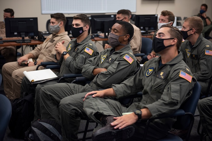 TraCORPUS CHRISTI, Texas (Oct. 30, 2020) The first students enrolled in Naval Aviation Training Next-Project Avenger receive briefings from dedicated instructors. Project Avenger is a prototype syllabus designed to train student naval aviators to a greater level of proficiency in a shorter period of time than the traditional syllabus to increase fleet aviator availability. (U.S. Navy photo by Anne Owens/Released)