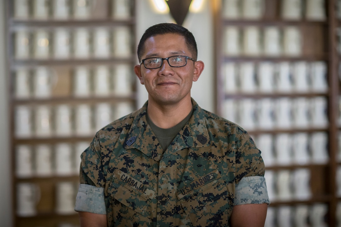 U.S. Marine Corps SgtMaj Luis Galvez, the Sergeant Major of Headquarters and Headquarters Squadron (H&HS), Marine Corps Air Station (MCAS) Yuma, reads a warrant during a promotion ceremony at MCAS Yuma, Ariz., Oct. 1, 2020.