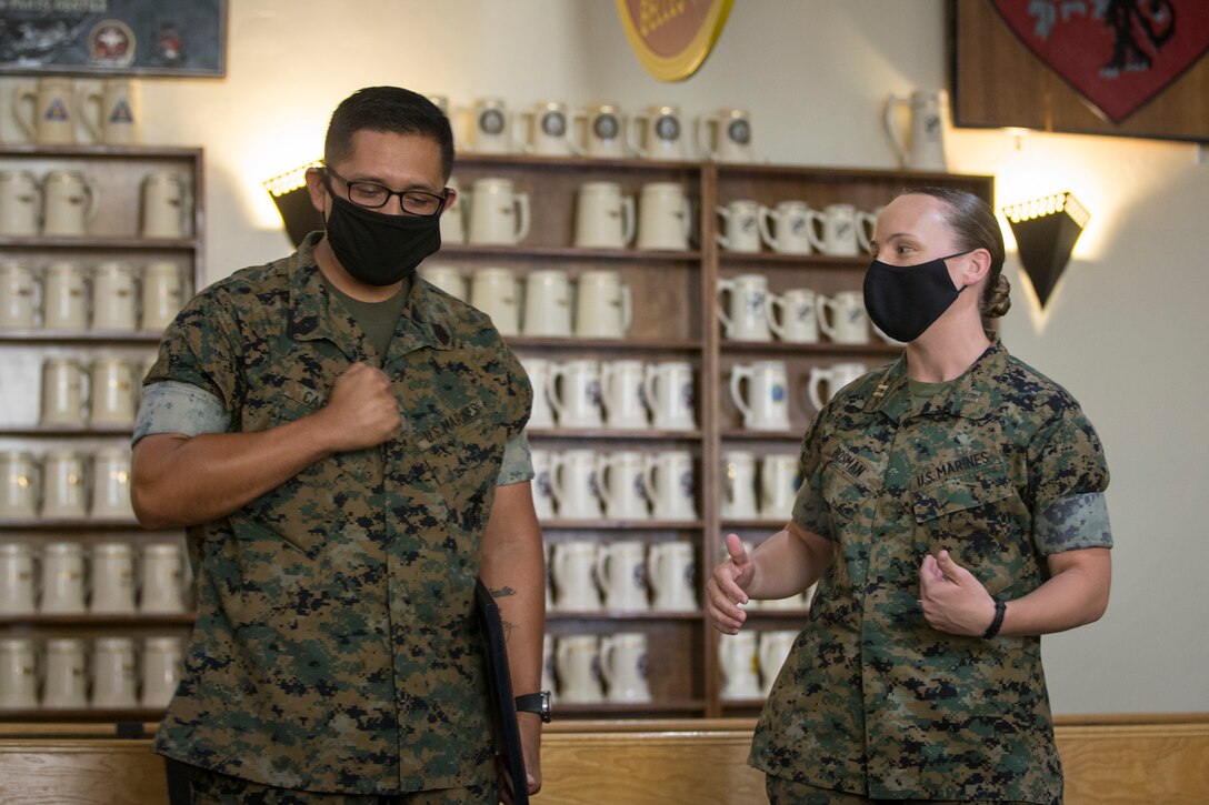 U.S. Marine Corps SgtMaj Luis Galvez, the Sergeant Major of Headquarters and Headquarters Squadron (H&HS), Marine Corps Air Station (MCAS) Yuma, reads a warrant during a promotion ceremony at MCAS Yuma, Ariz., Oct. 1, 2020.