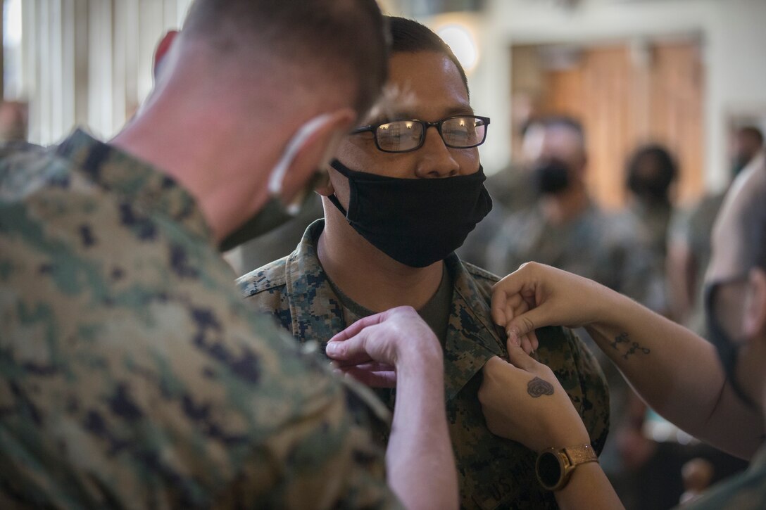 U.S. Marine Corps SgtMaj Luis Galvez, the Sergeant Major of Headquarters and Headquarters Squadron (H&HS), Marine Corps Air Station (MCAS) Yuma, reads a warrant during a promotion ceremony at MCAS Yuma, Ariz., Oct. 1, 2020.